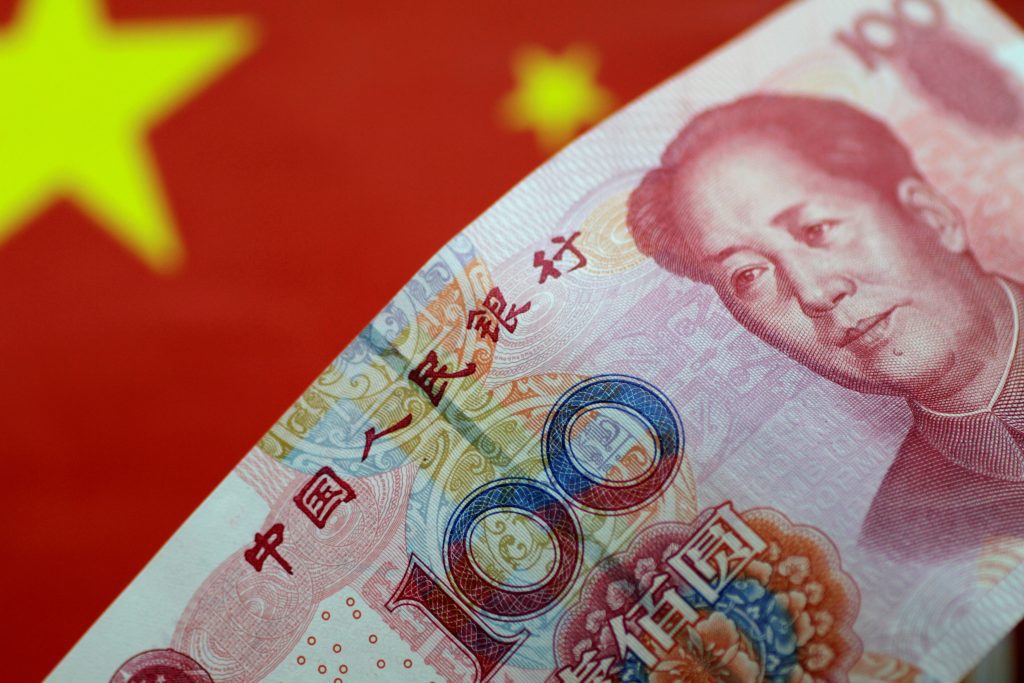 Head of China's central bank pledged to expand the international use of the digital yuan and called for the development of currency system.