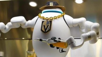 A robotic bartender serving drinks during the games at the T-Mobile Arena due to the increasing use of AI by hospitality businesses.