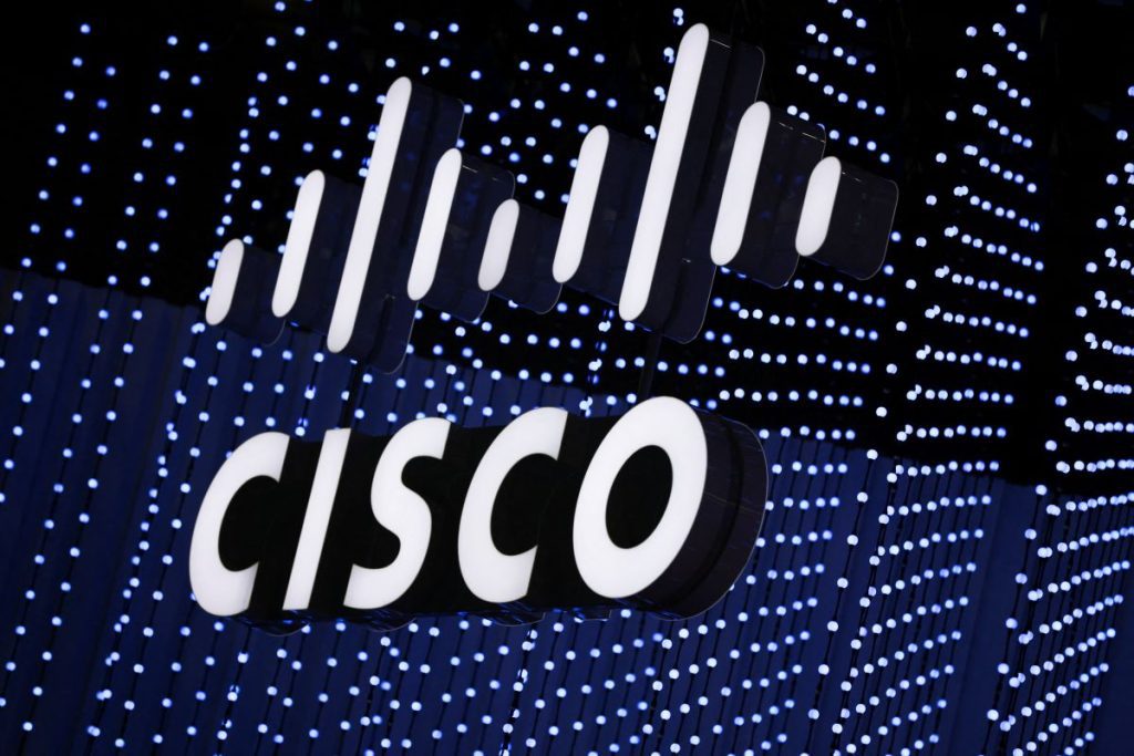 SAN FRANCISCO, Feb 10 (Reuters) - Cisco Systems on Tuesday launched a new chip and router designed to speed information through massive data centers.