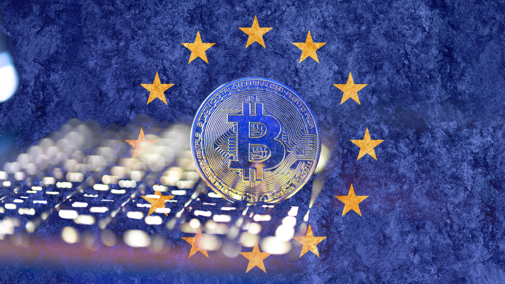 Bitcoin token displayed against the European Union flag, illustrating the EU’s MiCA crypto regulation review and the growing debate around tokenized deposits, stablecoins, and digital sovereignty.